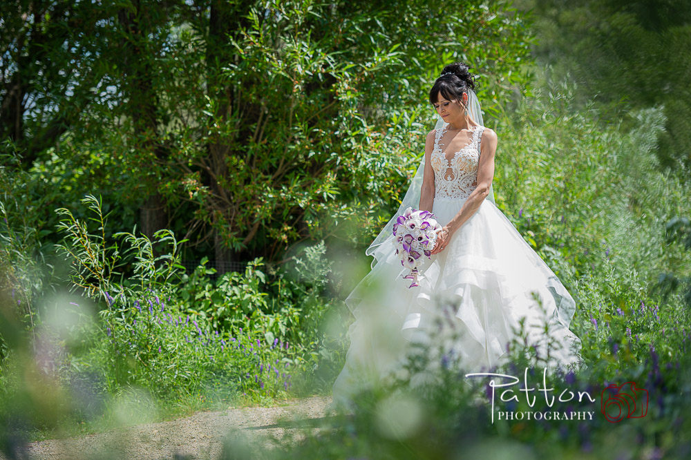 Calgary bride quiet moment alone on treed path
