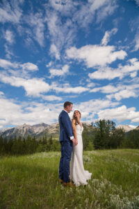 Bride and groom under a blue sky