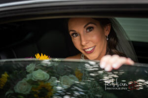 Calgary bride looking out of limo window at incredible Valley Ridge Golf Club