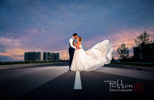 Bride and groom on Calgary road at dusk