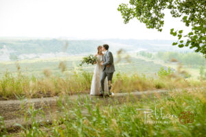 Calgary bride and groom kissing at Saskatoon Farm wedding
